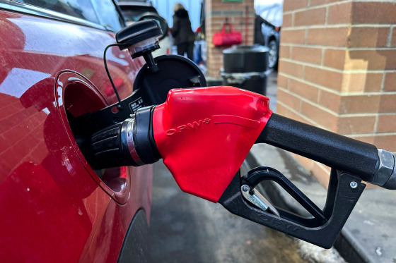 A gas pump inside of a car's gas port