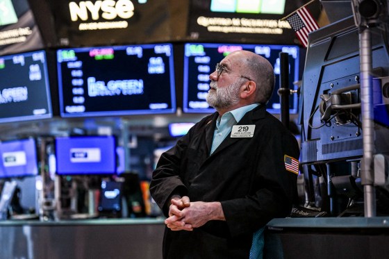 Image: A trader looks on after the opening bell on the floor of the New York Stock Exchange