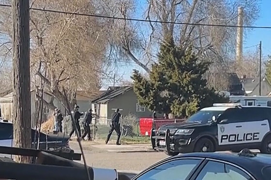 Police surround Victor Perez, 17, in his front yard in Pocatello, Idaho.