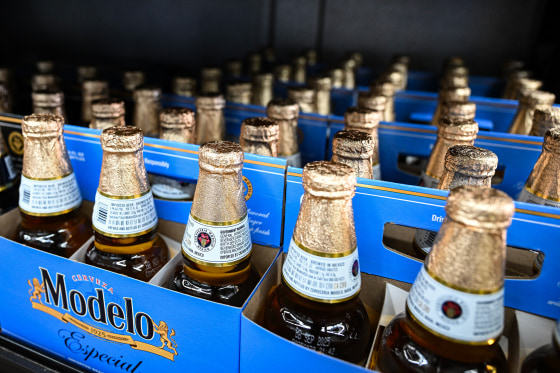 Six packs of Modelo beer on display in a store