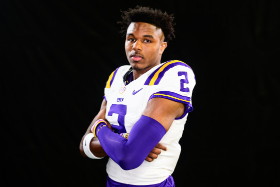 Kyren Lacy in his football uniform poses against a black background
