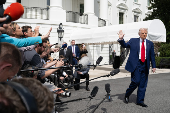 Reporters ask Donald Trump questions.