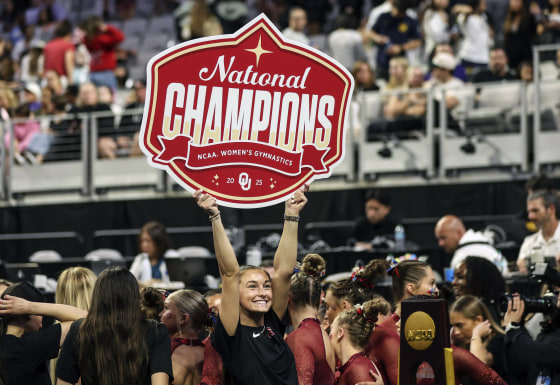 The Oklahoma women's gymnastics team celebrates winning