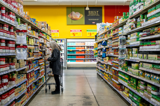 A person browses at a grocery store.