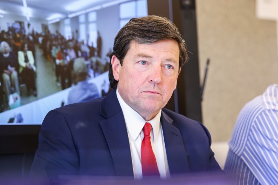 Edward Martin listening during a meeting