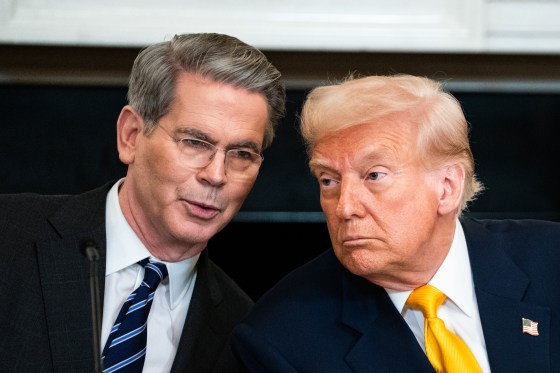 Scott Bessent, left, speaks with President Trump