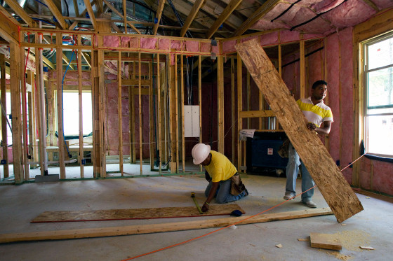 Workers building a home