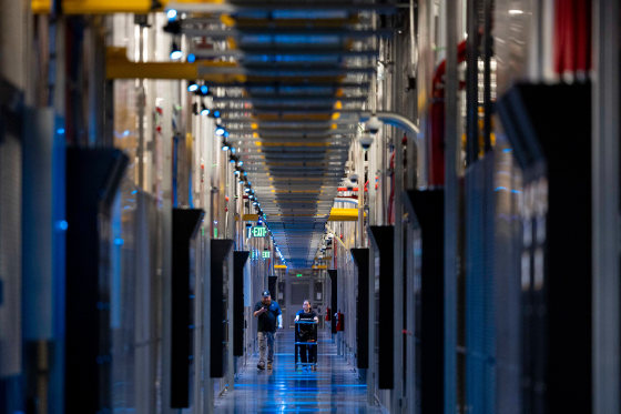 People walk through the hallways at Equinix Data Center