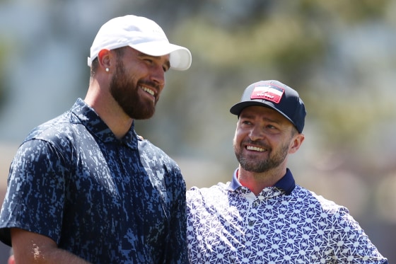 Travis Kelce and Justin Timberlake talking on the gold course