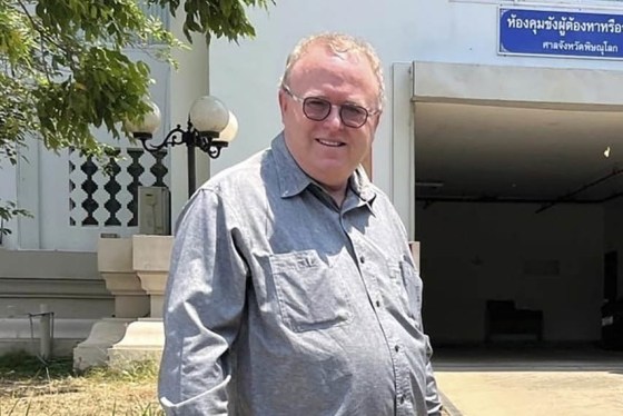U.S. political science lecturer Paul Chambers outside the police station in Phitsanulok, Thailand, where he was arrested on charges of insulting the monarchy.