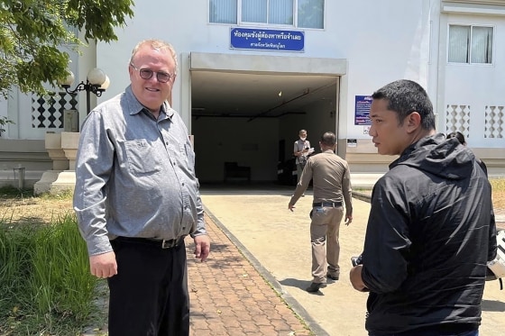 U.S. political science lecturer Paul Chambers outside the police station in Phitsanulok, Thailand, where he was arrested on charges of insulting the monarchy.