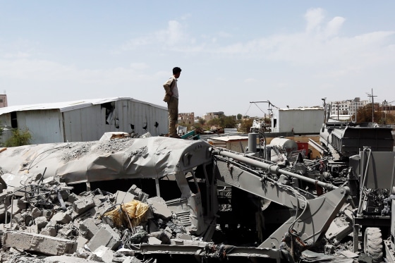 A man inspects damage