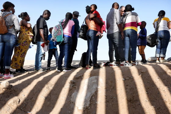 People wait in line outside