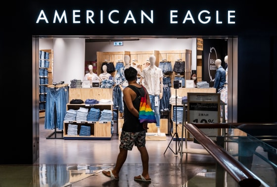 A shopper looks inside an American Eagle store in Hong Kong.