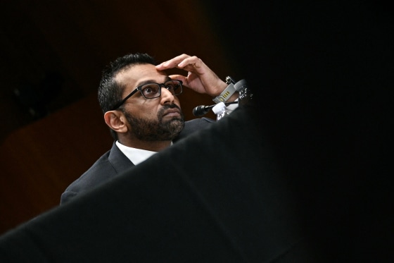 Kash Patel listens during a hearing.