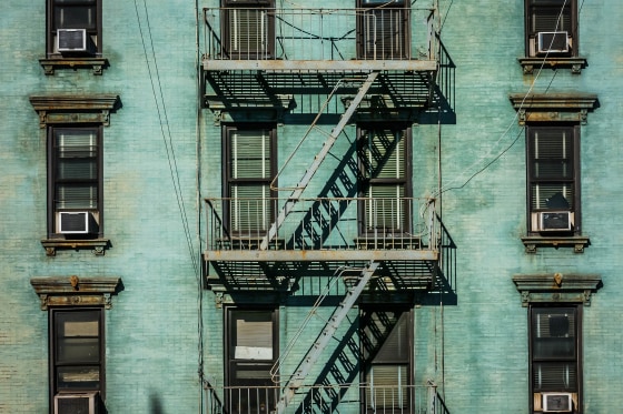 View of fire escape outside green New York apartment