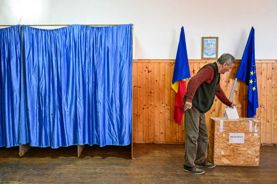 A person casts his vote.
