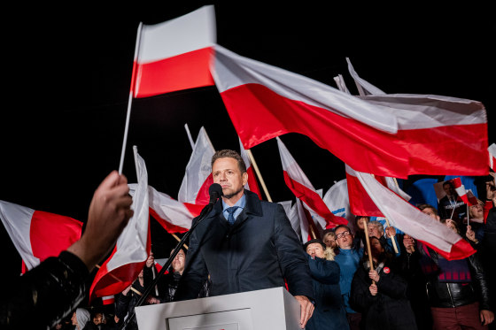 Rafal Trzaskowski at a rally surrounded by Polish flags