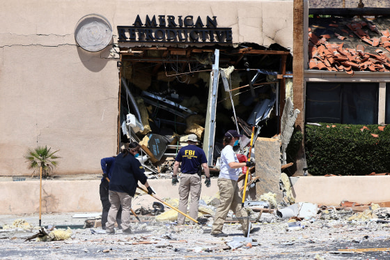 FBI and other law enforcement personnel gather evidenc