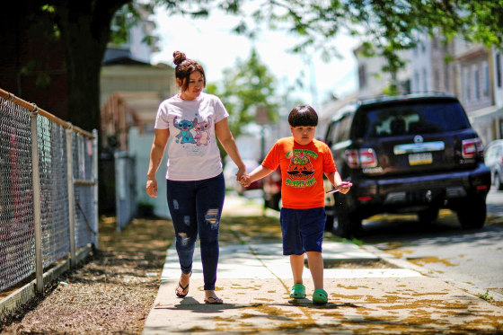 Wendy Ortiz walks with her son, Axel