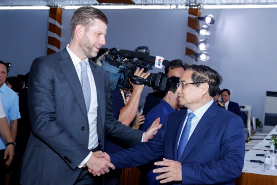 Eric Trump shakes hands with Vietnam's Prime Minister Pham Minh Chinh