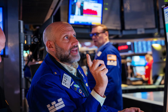 Traders work on the floor of the New York Stock Exchange on May 19, 2025.
