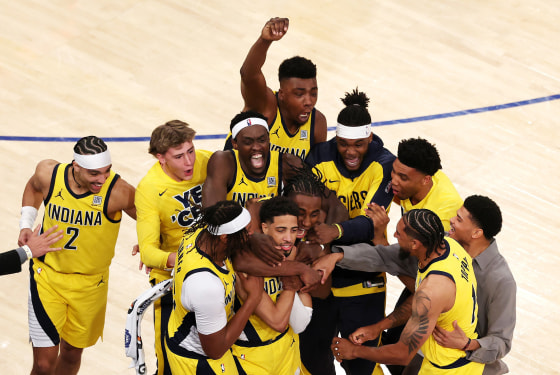 Indiana Pacers hugging Tyrese Haliburton
