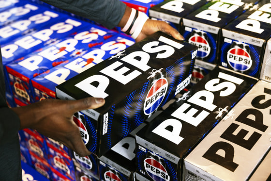 A worker stacks a case of Pepsi Zero Sugar at a supermarket