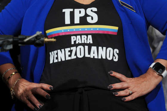 An activist wears a tee-shirt calling for Temporary Protected Status for Venezuelans