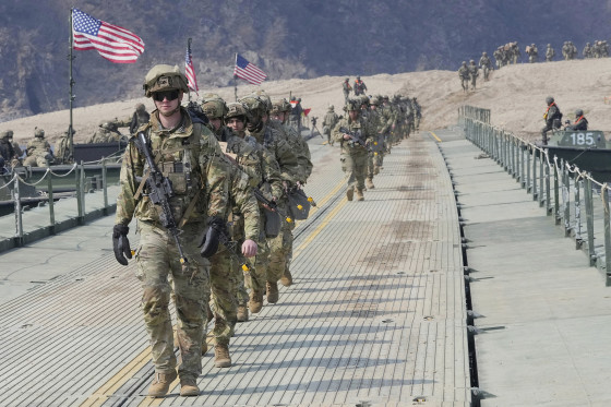 U.S. Army soldiers cross a floating bridge on the Imjin River during a joint river-crossing exercise in South Korea.