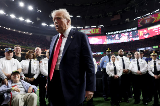President Donald Trump reacts after posing with family members of victims in the January 1 attack on Bourbon Street and emergency responders prior to Super Bowl LIX between the Kansas City Chiefs and the Philadelphia Eagles at Caesars Superdome on February 09, 2025. 