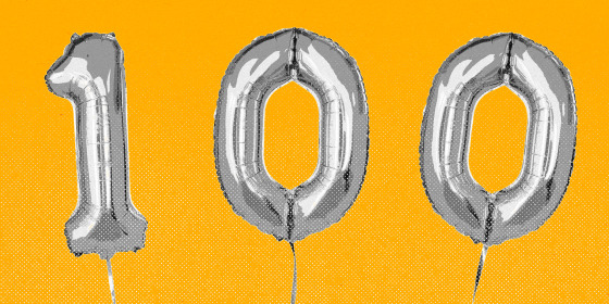 Balloons that spell the number 100, against a yellow background.