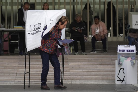 A voter leaves after casting her ballot in Mexico's first judicial elections in Mexico City, Sunday, June 1, 2025. 