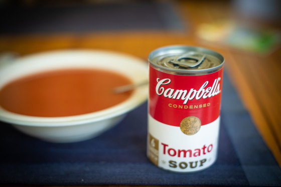 A bowl of soup and a can of Campbell's