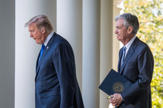 Donald Trump walks with Jerome Powell.