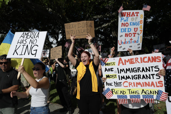 Protesters prepare to march near President Donald Trump's Mar-a-Lago home during a "No Kings Day" protest on June 14, 2025 in West Palm Beach, Fla.