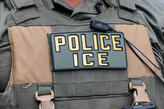 An ICE officer's bulletproof vest closeup