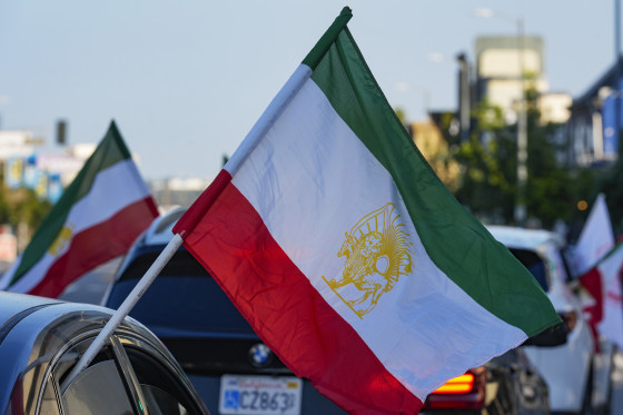 A caravan of vehicles rides while flying the Lion and Sun flag along Westwood Boulevard, in the so-called "Tehrangeles" neighborhood of Los Angeles, Calif., in 2024.