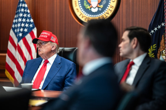 President Donald Trump sits at a table in the Situation Room