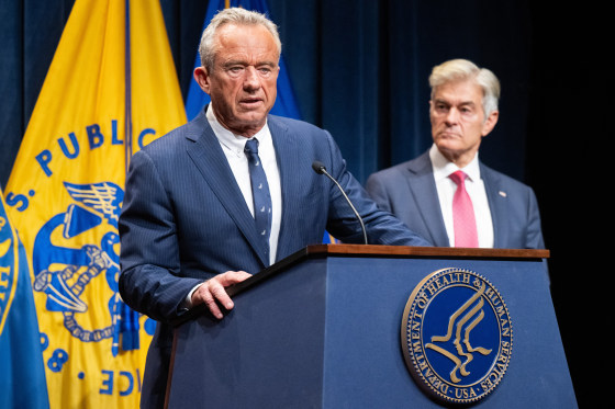 Image: Medicare and Medicaid Administrator Mehmet Oz, right, listens to Secretary of Health and Human Services Robert F. Kennedy Jr. speak