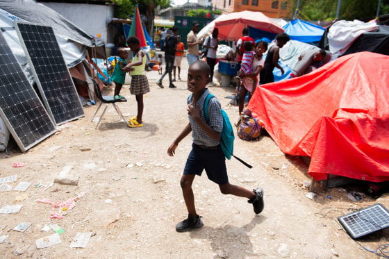 Image: A child leaves for school from a displaced persons camp