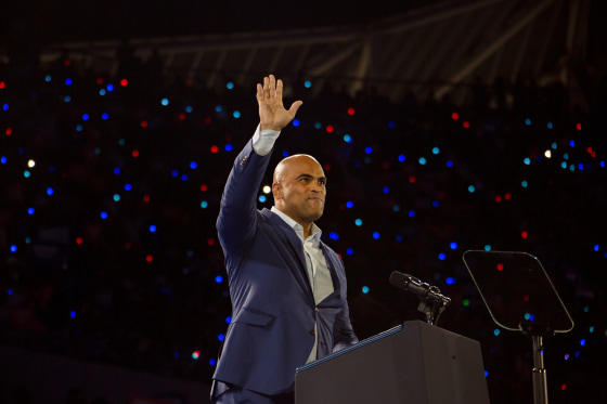 Colin Allred waves during a campaign rally for Kamala Harris in 2024.