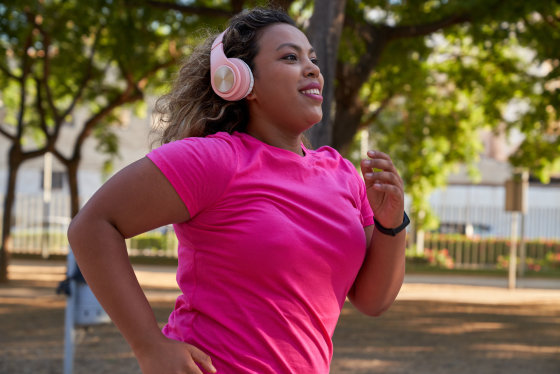 Latin woman running in city