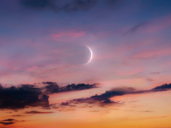 New Moon in the sky at sunset. 