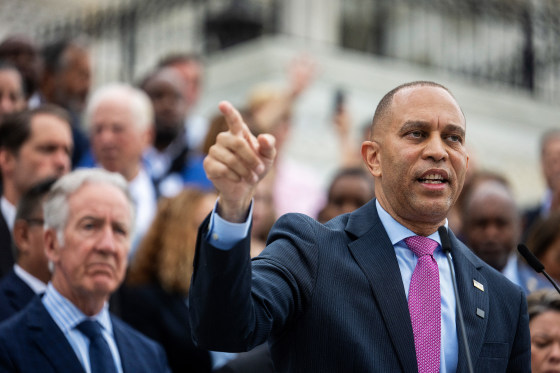 Hakeem Jeffries points as he speaks.