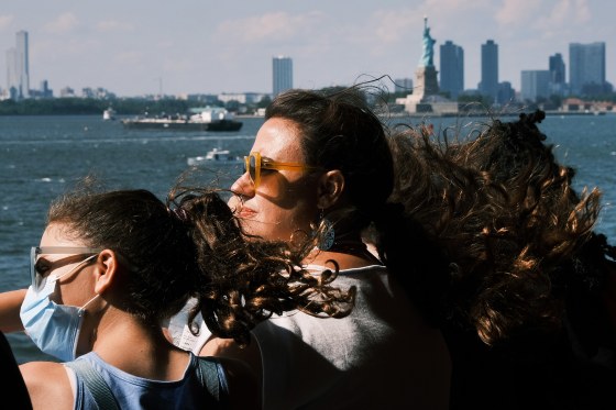 People ride on the Staten Island Ferry