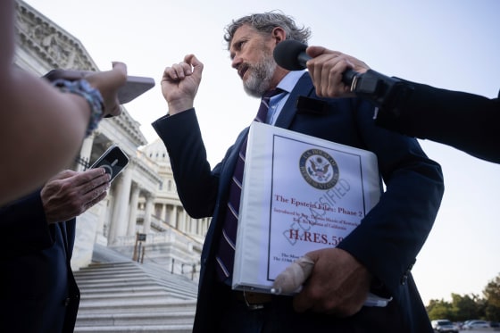 Rep. Thomas Massie, R-Ky., with a copy of his bill to force the House to vote on releasing the Epstein files.
