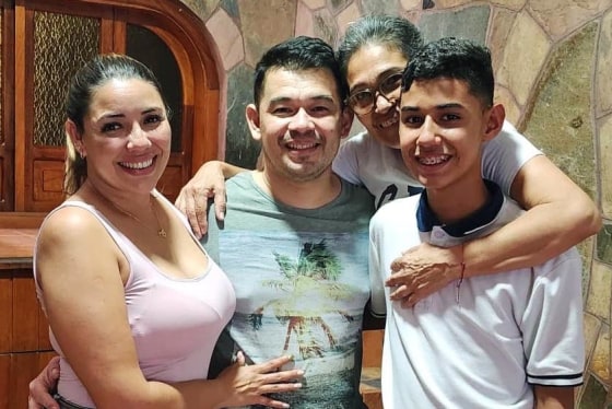 Andry Blanco Bonilla, center, is reunited with his family in Venezuela on upon reuniting with his family on Tuesday, July 22, 2025, after spending four months in CECOT prison in El Salvador.