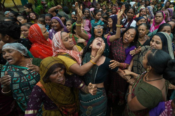 Family members and relatives of Akash Patni grieving during his funeral procession.