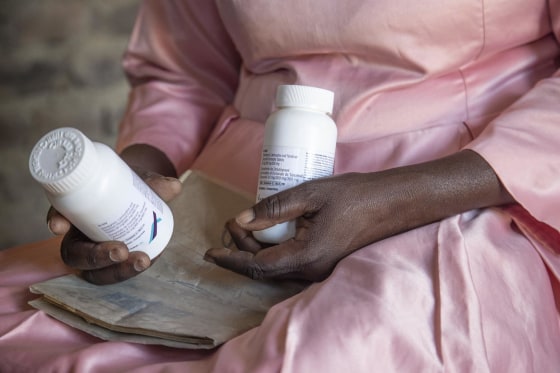 Florence Makumene holds HIV medication